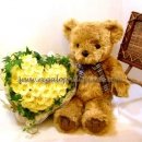 Teddy bear with yellow roses